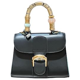 Borsa Delvaux Tempete Mini in pelle nera con bordi azzurro chiaro