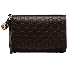 Tarjetero con solapa Gucci Brown Guccissima