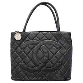 Borsa Tote Chanel in pelle di vitello martellata nera