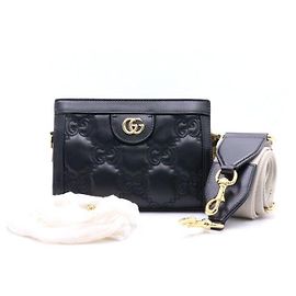 Gucci Mini borsa a tracolla e a spalla in matelassé con logo GG in rilievo nero e catena dorata