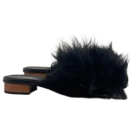 Mules Chanel noires T.37