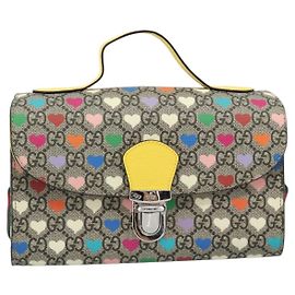 Bolso pequeño Gucci para niños con asa superior, solapa y lona revestida GG estampada