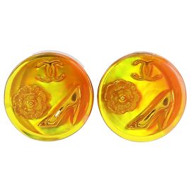 Orecchini a clip placcati oro con camelia con inserti in resina CC Chanel