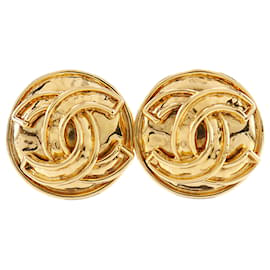 Orecchini a clip rotondi Chanel CC placcati oro