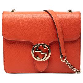 Piccola borsa a tracolla Gucci in pelle di vitello con doppia G intrecciata, arancione