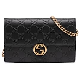 Borsa a tracolla con catena Gucci Guccissima nera con G intrecciate