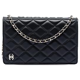 Bolso bandolera cartera Book en piel de cordero acolchado negro Chanel