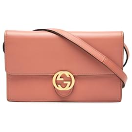 Portafoglio a tracolla Gucci in pelle rosa con G intrecciate e motivo dollar