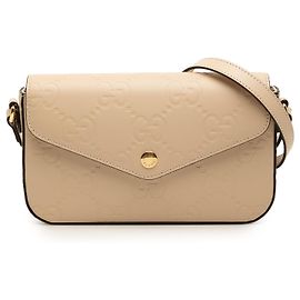 Borsa a tracolla pochette Gucci Super Mini GG Jumbo in pelle goffrata beige