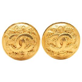 Orecchini a clip rotondi Chanel CC placcati oro a motivo di vite