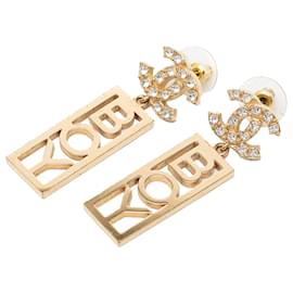 Orecchini Boy Swing in ottone e strass con CC Chanel dorati