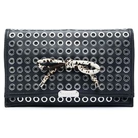 Clutch Burberry Prorsum de piel de cordero y pelo de poni con ojales y lazo, negra