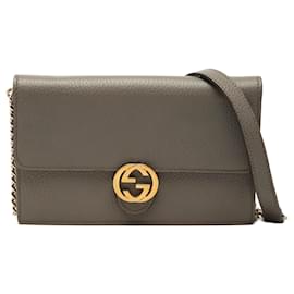 Portafoglio con catena Gucci Dollar in pelle di vitello marrone con G intrecciate