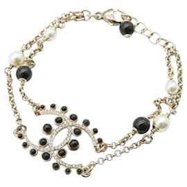 Bracciale Chanel placcato oro CC con perle finte e strass
