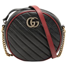 Borsa a tracolla rotonda Gucci Mini GG Marmont in pelle matelassé Torchon nera