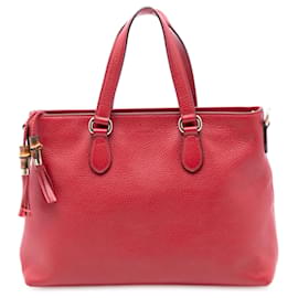 Borsa satchel Gucci in pelle rossa con manico in bambù e nappa