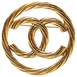 Spilla rotonda Chanel CC placcata oro