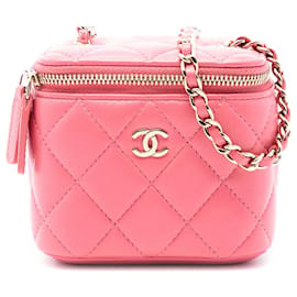 Mini Vanity Case Chanel in agnello trapuntato rosa con manico e tracolla a catena
