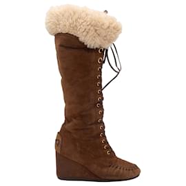 Stivali alti con zeppa in shearling marrone Miu Miu Taglia 37.5
