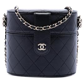 Clutch Vanity rotonda in agnello trapuntato Chanel CC nero con catena
