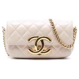 Portamóvil Chanel de piel de cordero acolchado beige con Giant CC y bolso bandolera con cadena