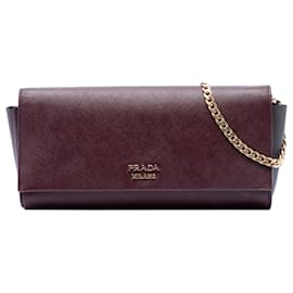 Clutch Bibliotheque in Saffiano e pelle City rossa con tracolla a catena Prada