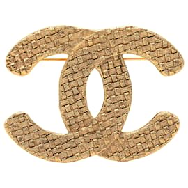 Spilla Chanel CC trapuntata placcata oro