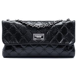 Borsa a tracolla Chanel Mademoiselle in pelle di vitello craquelé laccata nera