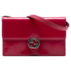 Portafoglio con catena Gucci in pelle rossa con logo G Dollars intrecciati