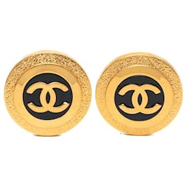 Orecchini a clip rotondi in resina con logo CC Chanel dorati e neri