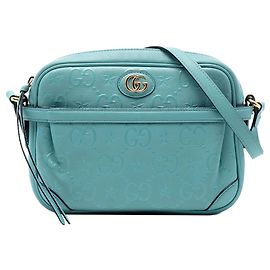 Borsa a tracolla in pelle blu con stampa a rilievo GG Star Gucci