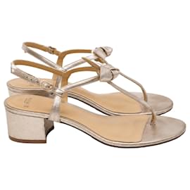 Sandali con tacco Alexandre Birman Clarita con decorazione a fiocco in pelle dorata