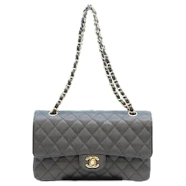 Borsa a tracolla Chanel A01112 in pelle Caviar Matelassé