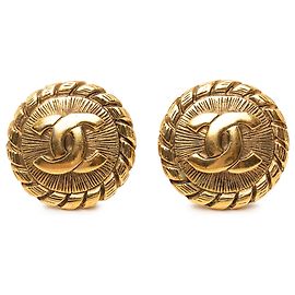 Orecchini a clip rotondi Sunburst Chanel Gold CC placcati oro