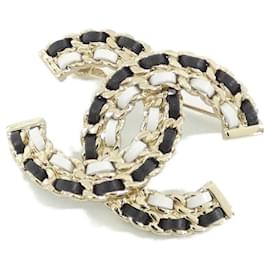 Spilla Chanel AB8605 in pelle oro e blu navy