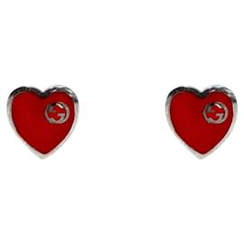 Verschlungene Silberohrringe mit rotem Herz - Gucci