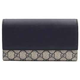 Gucci Cartera larga para mujer con solapa en GG Supreme Canvas