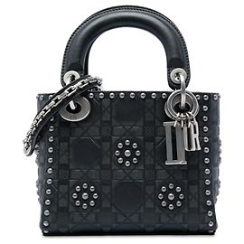 Dior Mini Lady Dior in vitello Cannage nero con borchie a fiore