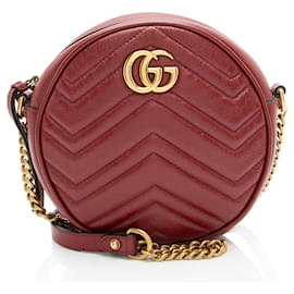 Borsa a tracolla mini rotonda GG Marmont in pelle matelassé Gucci