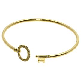 Bracciale rigido Tiffany & Co. in oro giallo 18K con chiave ovale