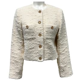 Frame Denim Chaqueta cropped Frame de tweed color crudo con botones frontales
