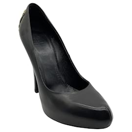 Givenchy Plateauschuhe aus schwarzem Leder mit goldfarbenen Metallelementen