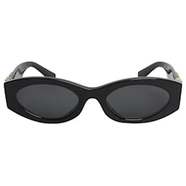 Lunettes de soleil ovales noires et dorées - Miu Miu