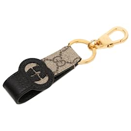Llavero y colgante Gucci GG Supreme y piel de becerro beige con G entrelazadas