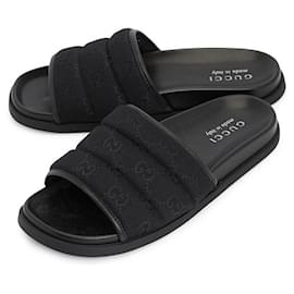 Sandali Gucci neri in metallo da uomo