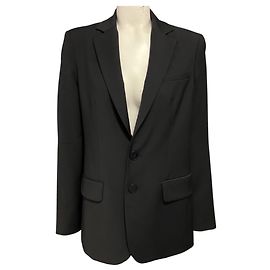 Blazer Marlon Tibi de lana tropical negra con recortes en las mangas