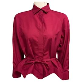 Alaïa Top in cotone Alaia Cranberry a maniche lunghe, orlo peplum, abbottonato con fiocco frontale