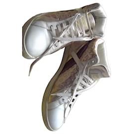 Sneakers Louis Vuitton in pelle bianca e oro