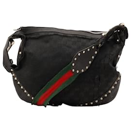 Borsa hobo Gucci in tela monogram con borchie
