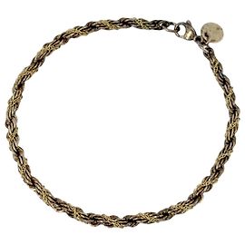 Bracciale con charm Tiffany & Co. in oro 18K e argento